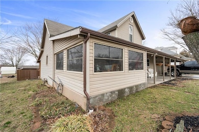 View of home's exterior with a patio area and a yard