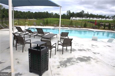 Community pool featuring a patio area