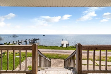 Property view of water with a dock