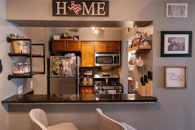 Kitchen featuring appliances with stainless steel