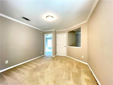 Unfurnished room featuring carpet flooring and ornamental molding