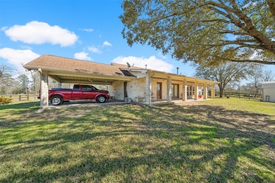 The home features a welcoming porch, large covered