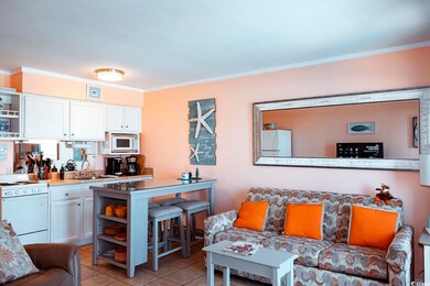 Living area with light tile patterned floors and o