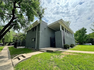 View of front of house featuring brick siding and crawl space