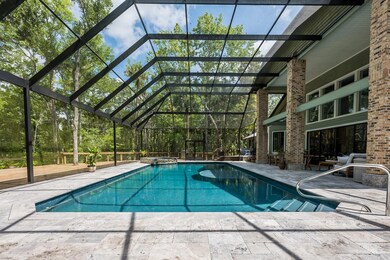 Screen salt water pool, spa and covered lanai and the expansive deck combine to create the outdoor living space dreams are made of.