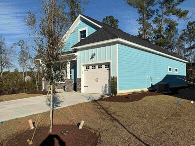 Garage featuring concrete driveway and central AC 