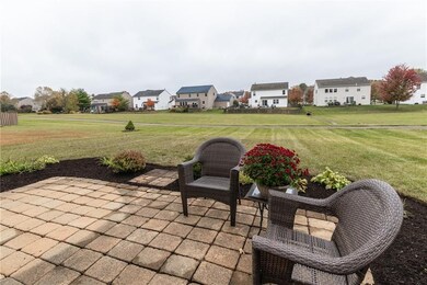 Paver patio and view of rear yard from home.