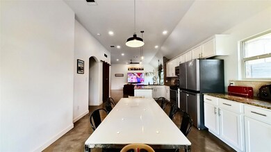Kitchen featuring a center island, appliances wit