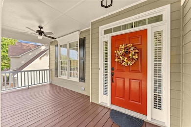 Everything about this front porch is just happy! Freshly painted and built to be larger than most in the neighborhood, you can relax and watch the kids play. Note the ceiling fan for warmer months.