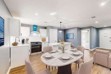 Dining space with light hardwood / wood-style floo
