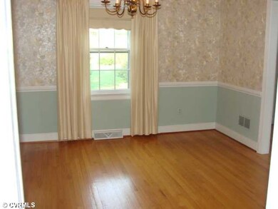 Dining Room - The formal dining room with wood floors