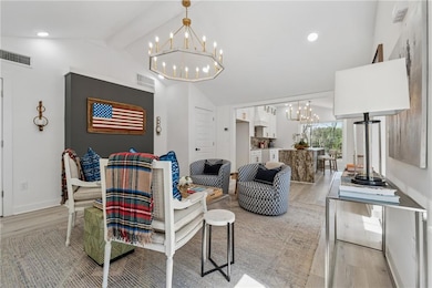 Living area featuring light wood-style flooring, l