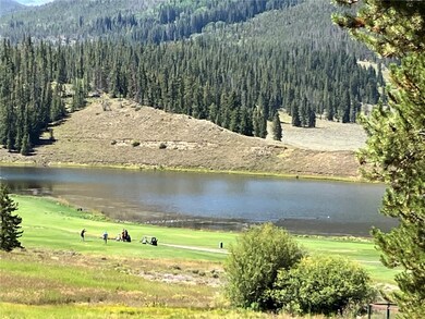 View of golf course and lake from deck