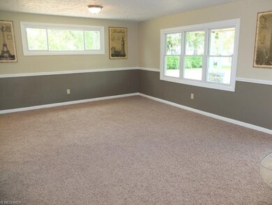 Spacious living room with chair rail.