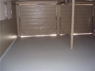 LARGE 2 CAR GARAGE WITH PAINTED WALLS AN