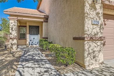 Entrance to property with stucco siding