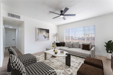 Living room featuring wood finished floors, a ceil