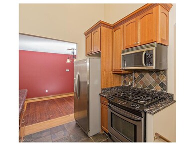Kitchen opens to Dining Room.