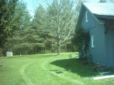 Exterior Front End of house and side yard