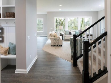 Mud room and garage to the left. Pristine views of