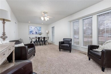 Bright, airy living room and dining area with kitc