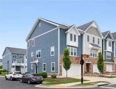 Townhome / multi-family property with stone siding