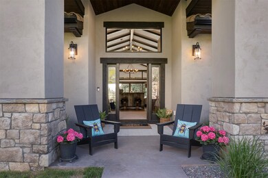 View of exterior entry featuring stucco siding and stone siding