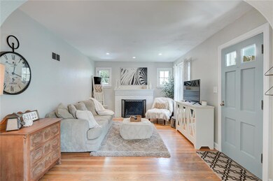 Living Room ~ Wood floors, wood burning fireplace 