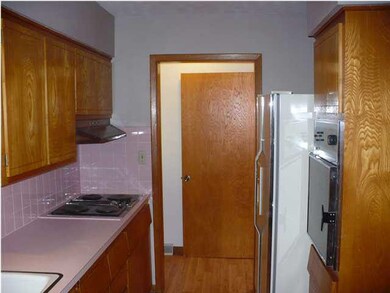 KITCHEN WITH COUNTER TOP STOVE, BUILT IN OVEN AND 