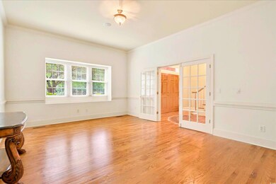 Spare room featuring french doors, ornamental mold