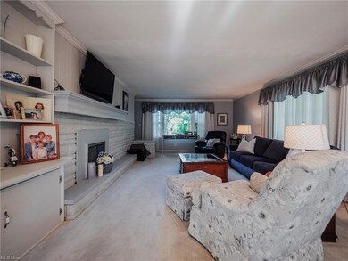 Living room with huge picture windows front and si