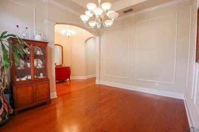 Unfurnished room featuring ornate columns, ornamen