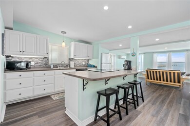 Kitchen has an island/eating bar.