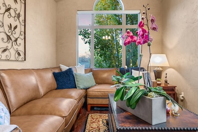 Living room with wood finished floors and a textured wall