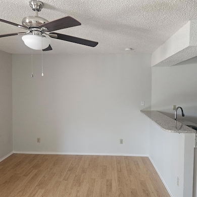 Spare room with light wood finished floors, a sin