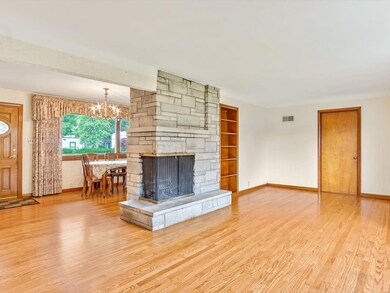 Next you will find yourself in the cozy living room with a wood burning fireplace.