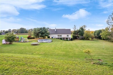 Backyard complete with pool, hot tub, trampoline, 