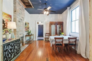 Dining Room with exposed brick decorative fireplac