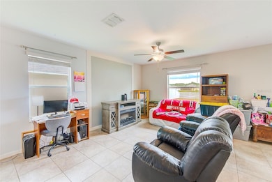 Great room boasts a ton of natural light and a large space for everyone to enjoy just off of the kitchen/dining areas.