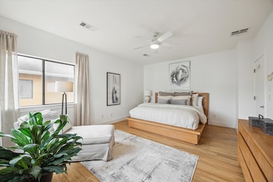 The primary bedroom features a modern design with
