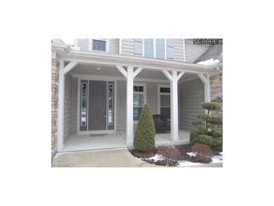 The covered front porch leads to the door and invi