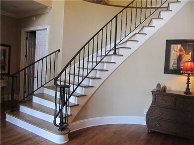 Dramatic circular stairway to welcome guests.