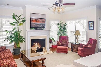 The living room has hardwood floor, gas fireplace,