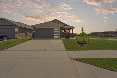 View of front of property with driveway, a front y