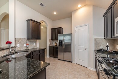 Large kitchen with SS appliances, storage galone, extended granite countertop space and walk in pantry. Open view to family room, breakfast nook and breakfast bar, makes dining fun.