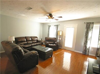 Living Room with tons of natural light and Hardwoods