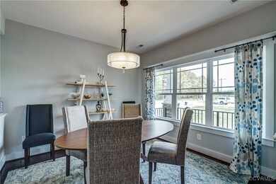 Dining area featuring visible vents, baseboards, a