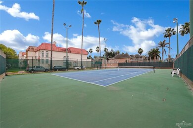 View of sport court featuring fence