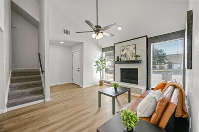 Living room featuring ceiling fan, high vaulted ce
