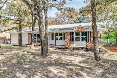 Ranch-style house with brick siding and a porch